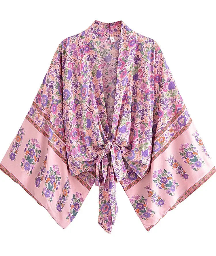 Floral patterned scarf with a pink border on a white background