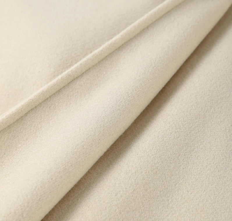 Close-up of beige fabric with a soft texture