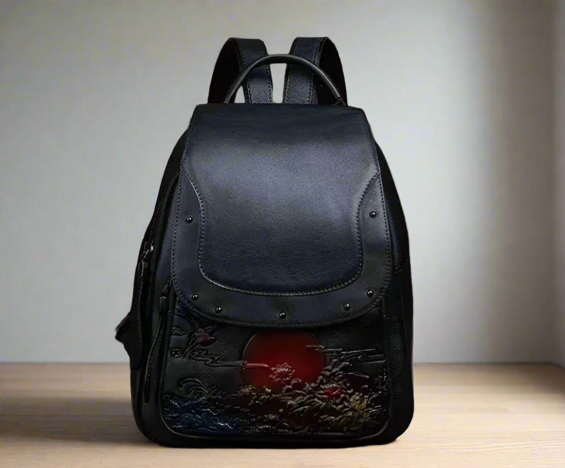 Black leather backpack with floral design and red circle on a light background