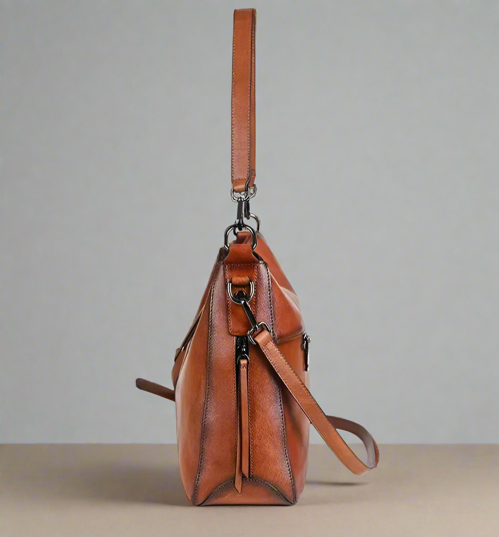Brown leather bag shown from two angles on a white background