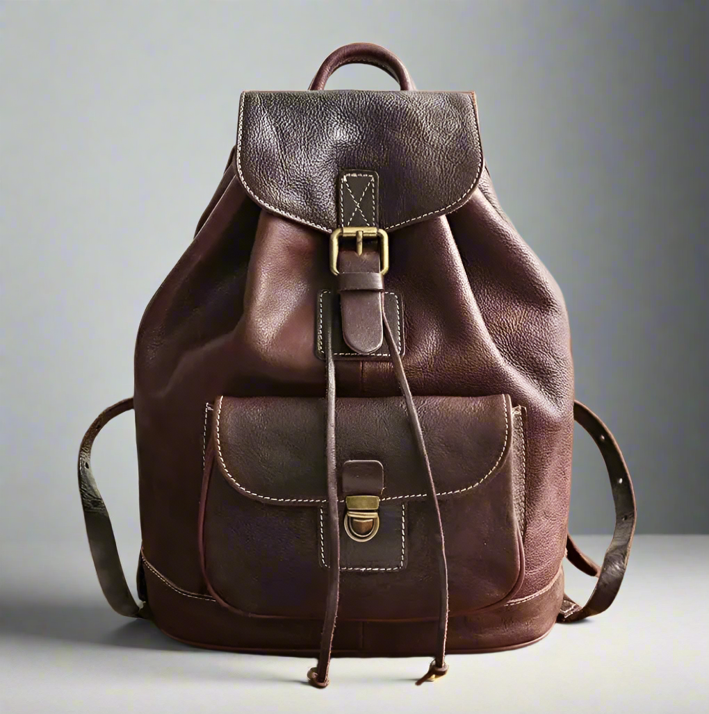 Brown leather backpack on  a neutral background