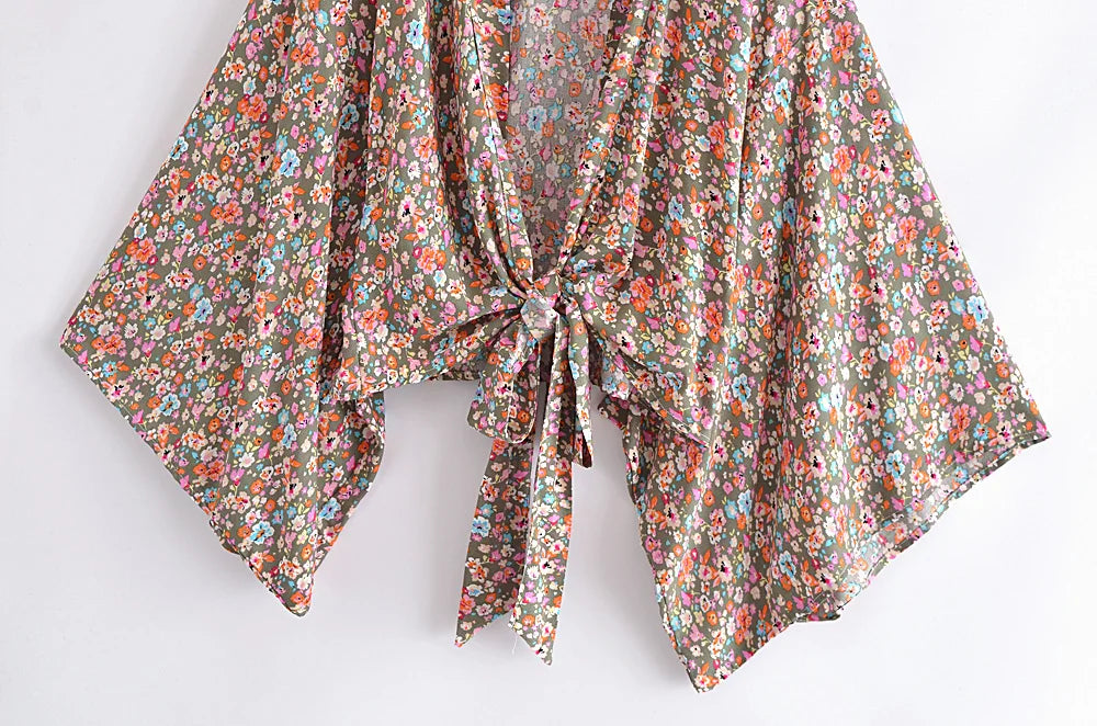 Floral patterned scarf with a knot on a white background