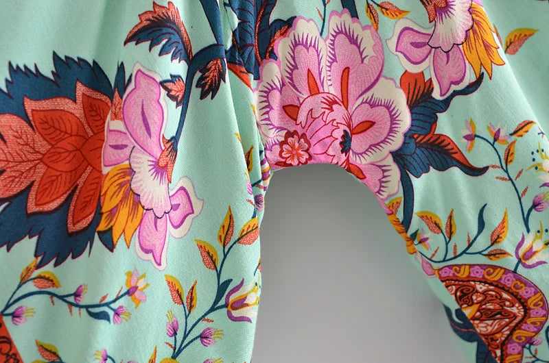 Colorful floral and bird pattern on a fabric swatch