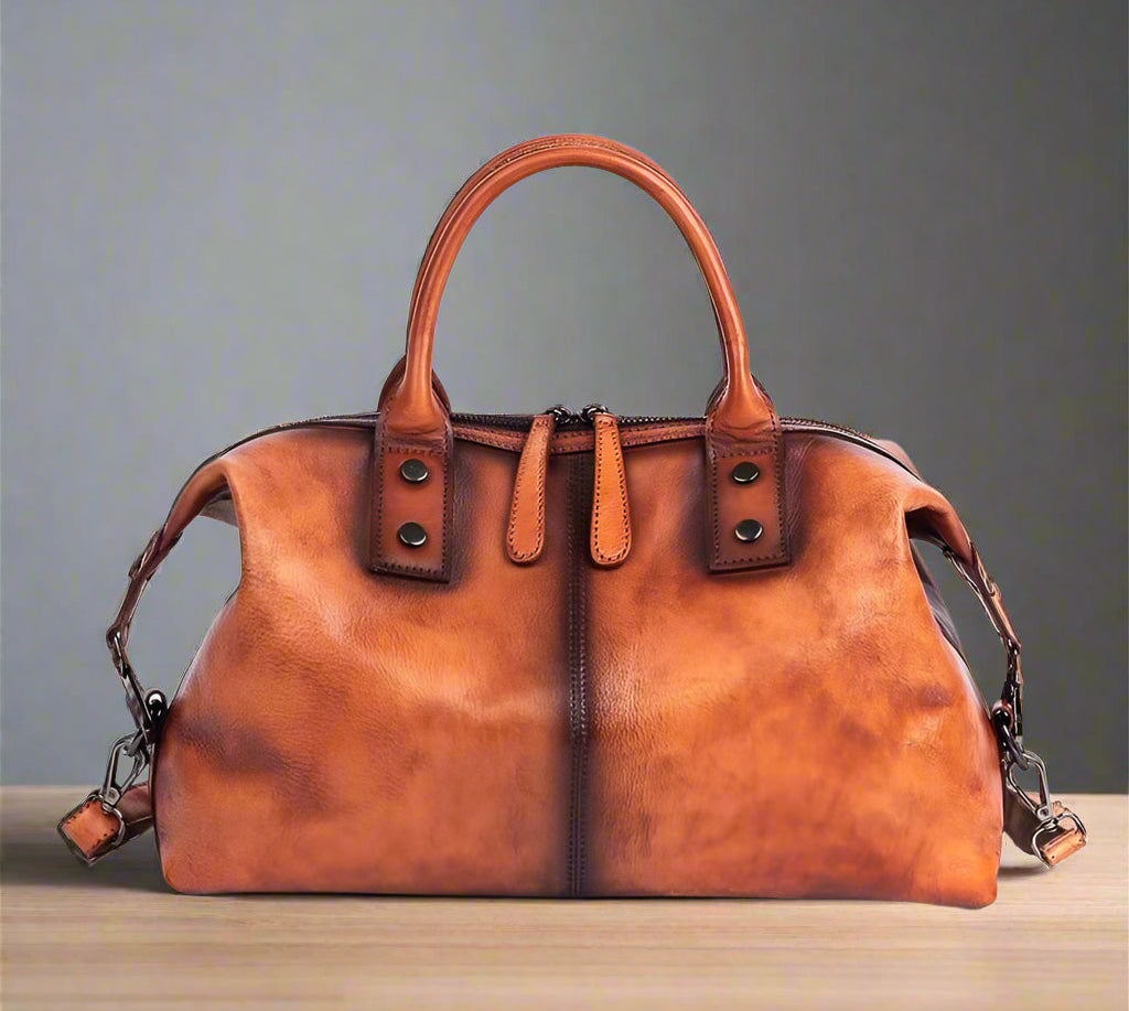Brown leather handbag on a white background