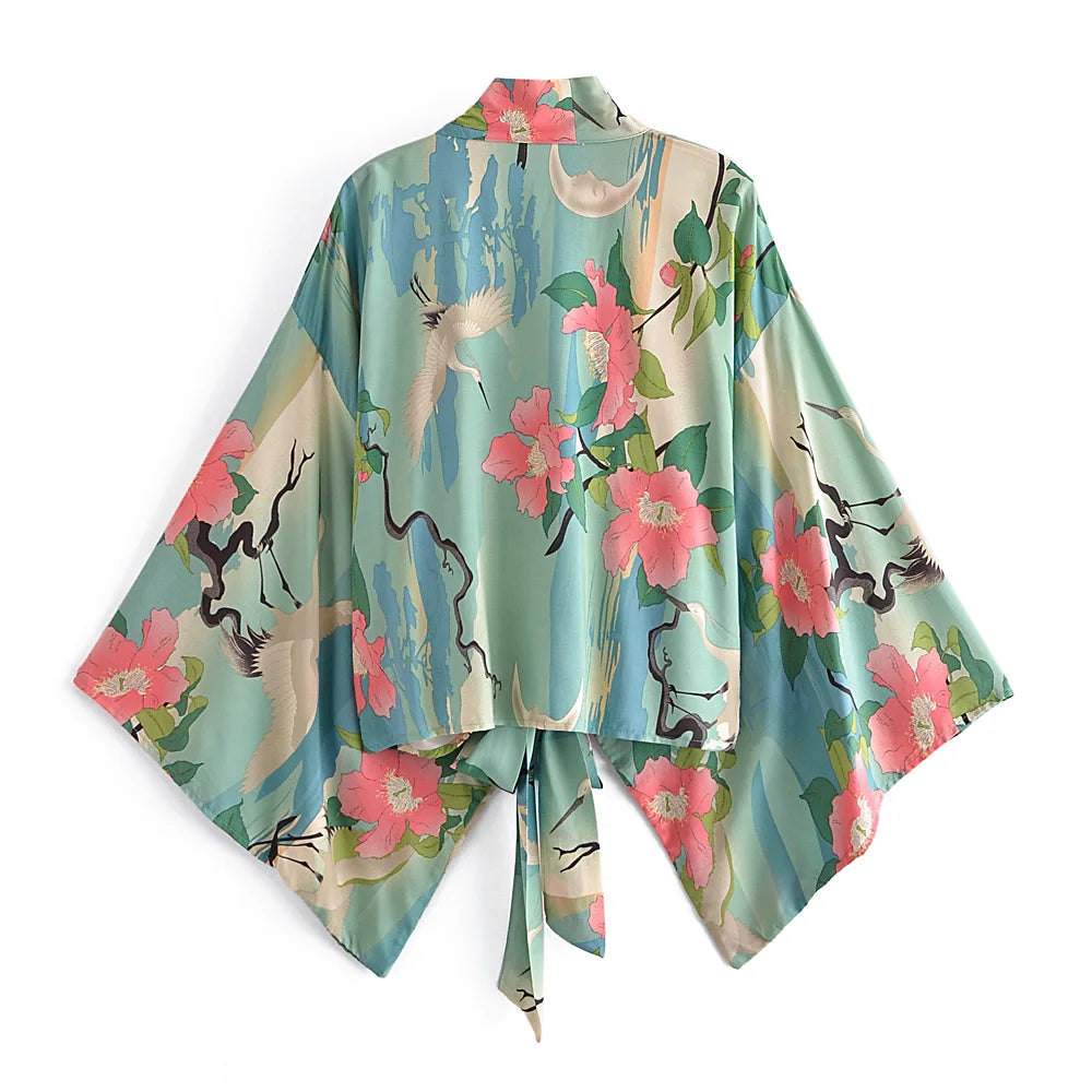Floral and deer patterned kimono on a white background