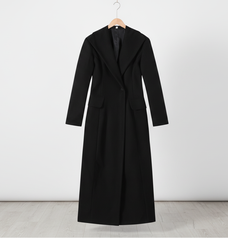 Black coat on a hanger against a white background