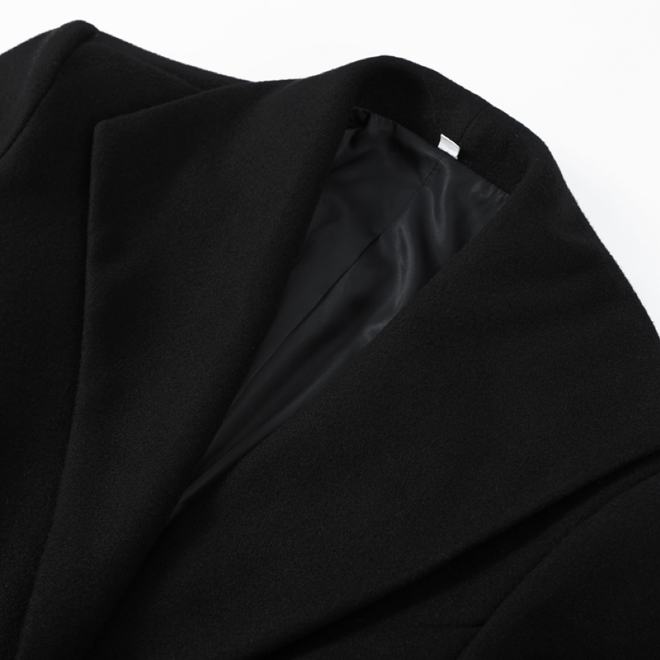 Close-up of a black fabric texture on a white background