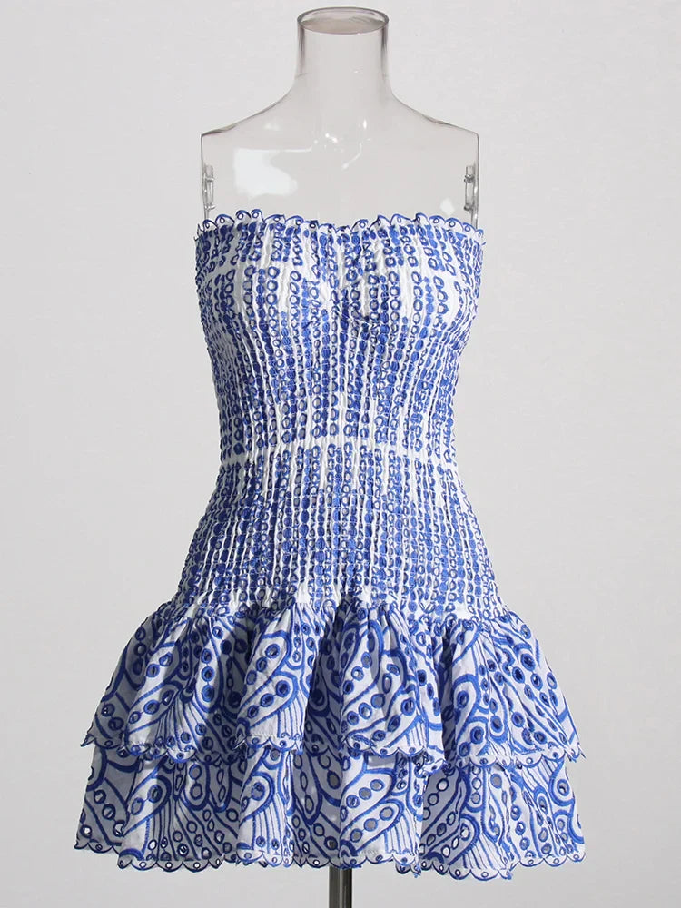 Blue and white patterned strapless dress on a mannequin against a white background