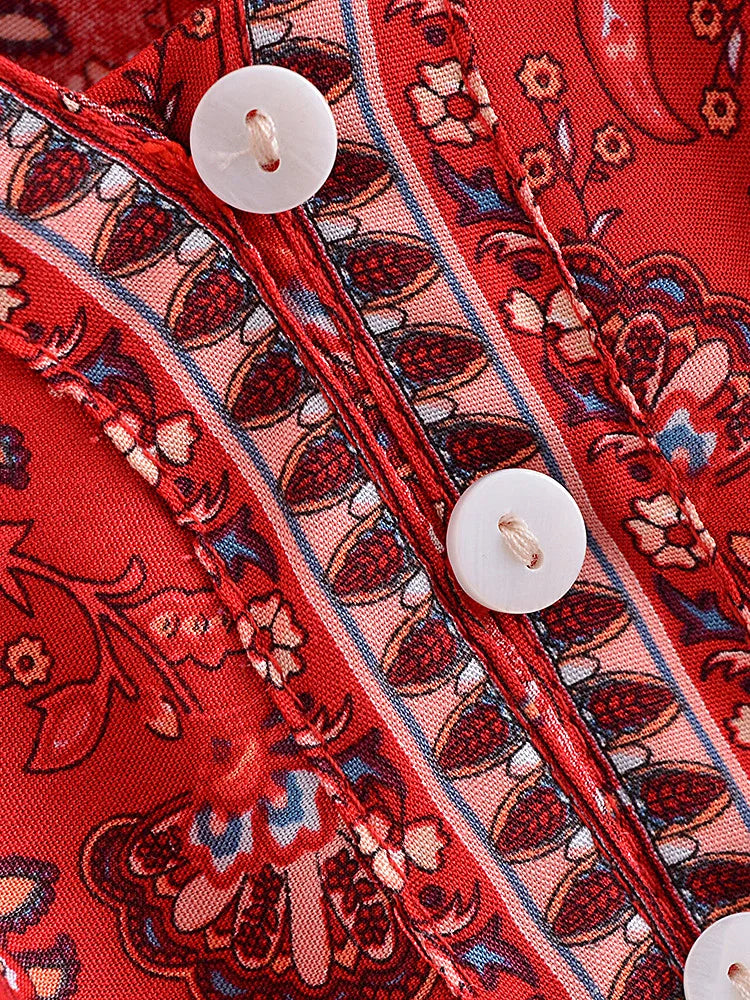Close-up of a red patterned fabric with buttons