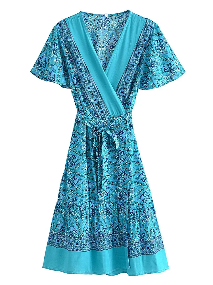 Blue patterned dress on a white background