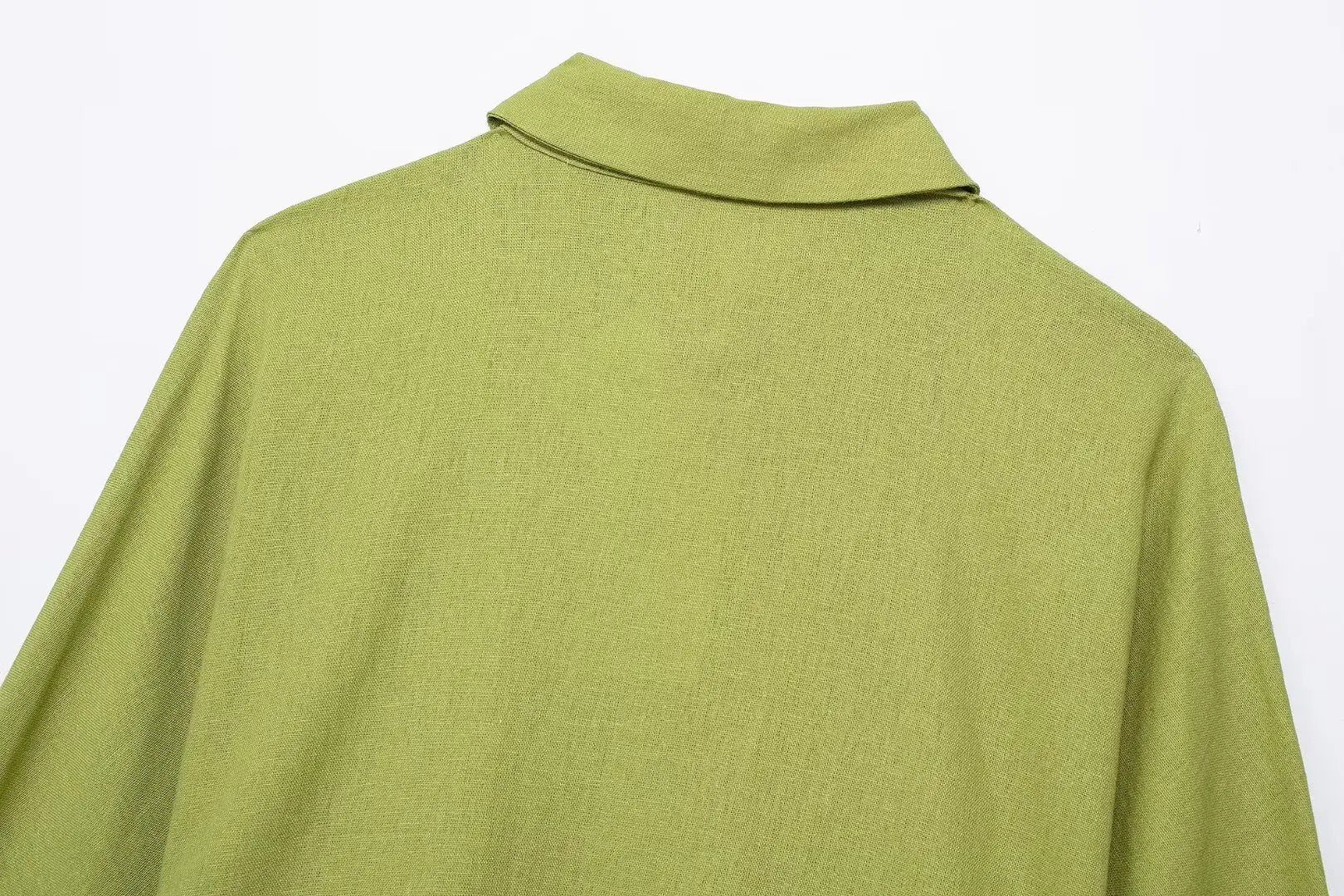 Green shirt with a collar on a white background