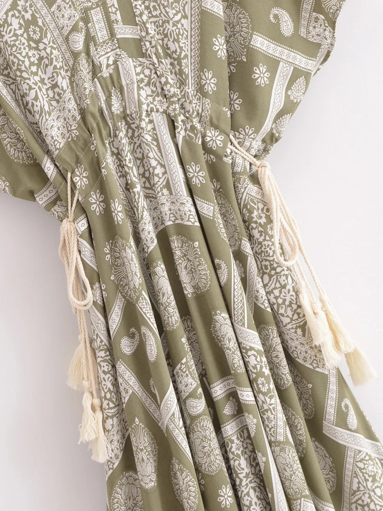 Green dress with white pattern on a white background