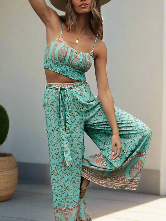 Woman wearing a turquoise floral outfit in an outdoor setting