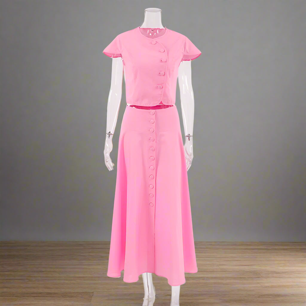 Pink dress on a mannequin against a white background