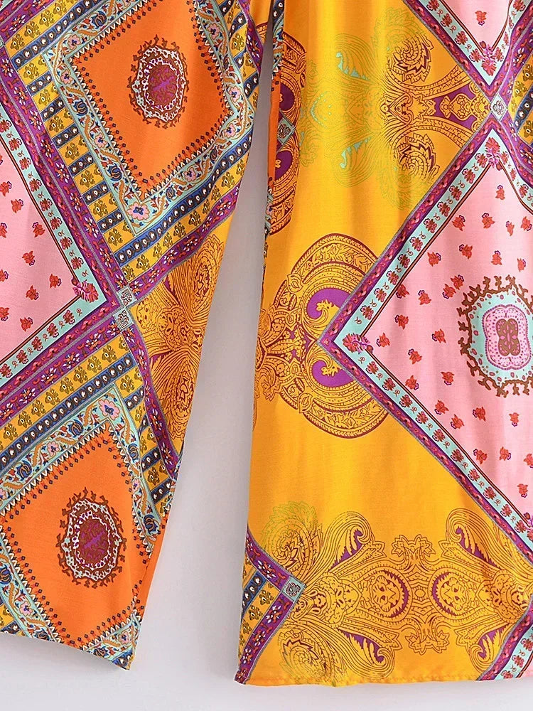 Colorful patterned fabric with geometric designs on a white background