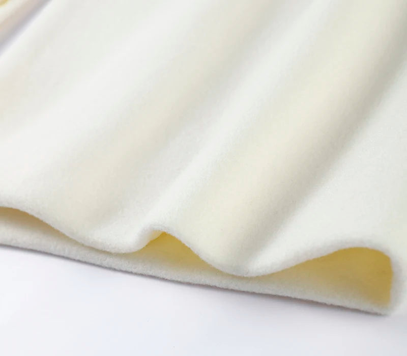 Close-up of a white foam pad with a beige border on a white background
