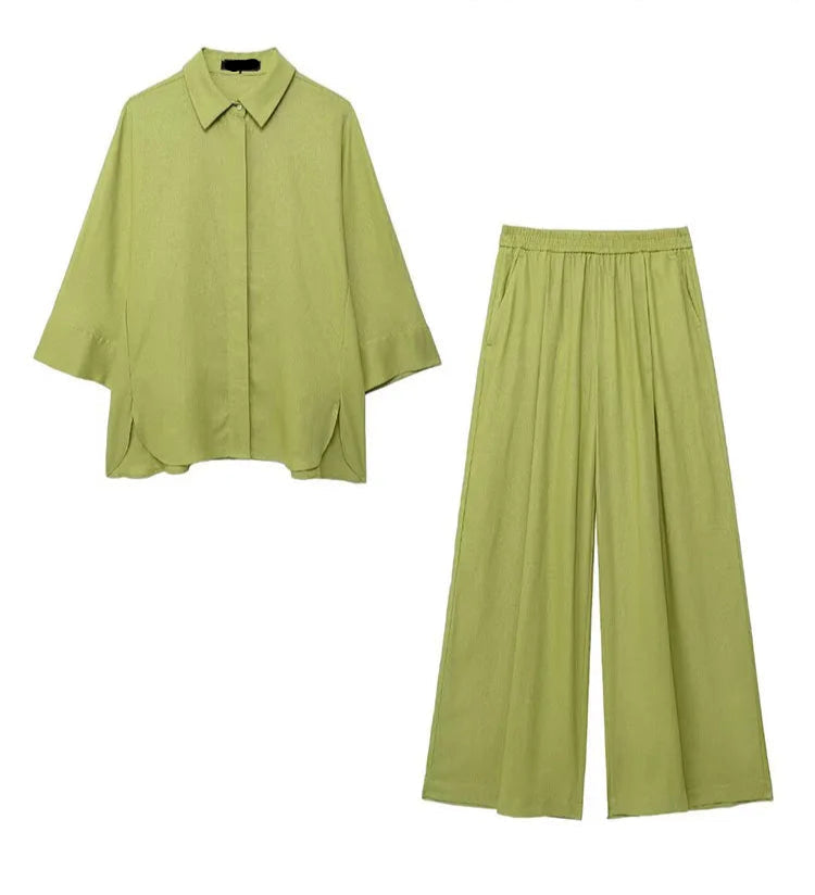 Green shirt and wide-leg pants on a white background