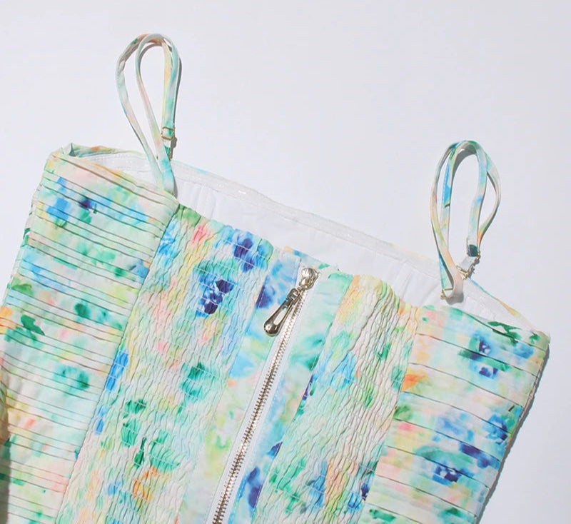 Colorful zippered pouch with watercolor design on a white background