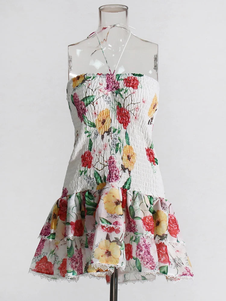 Floral dress on a mannequin against a white background
