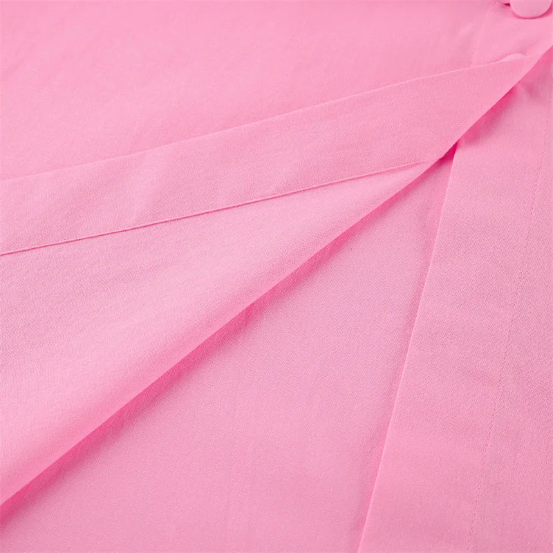 Close-up of pink fabric with a button