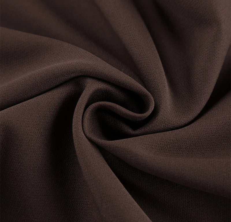 Close-up of brown fabric with folds