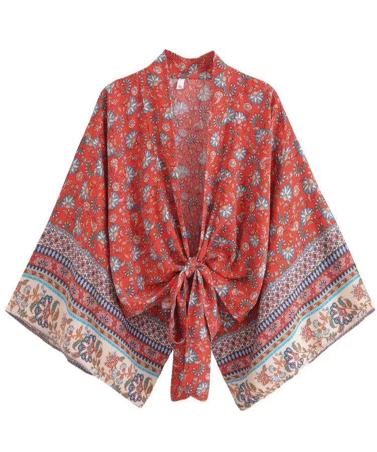 Red floral patterned kimono-style garment on a white background