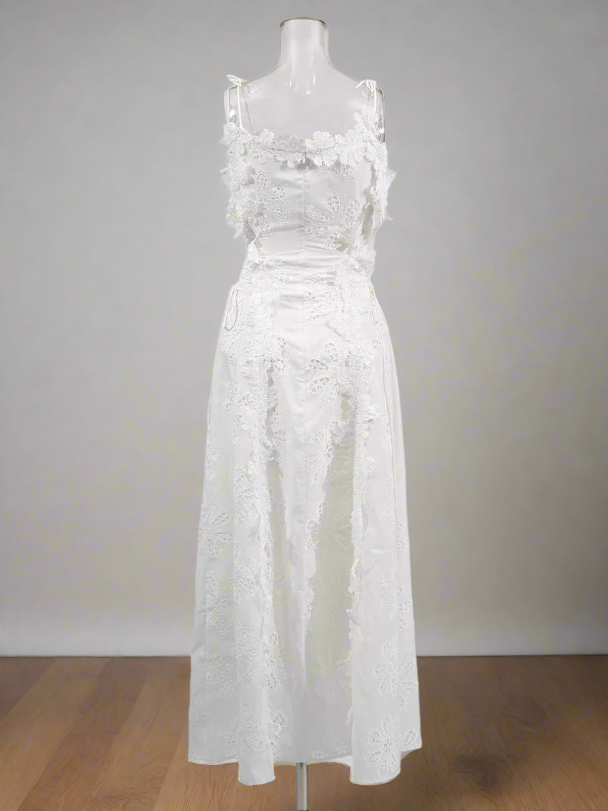White lace dress on a mannequin against a white background