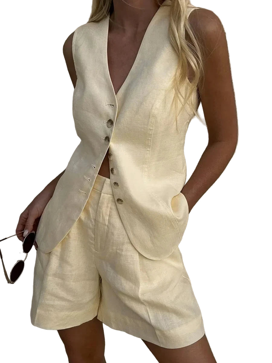 Person wearing a light yellow vest and shorts set against a white background