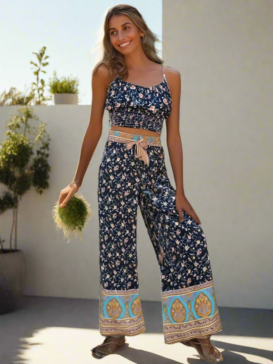 Woman wearing a floral outfit set  standing outdoors.