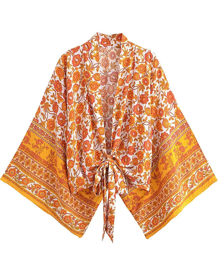 Orange and white floral patterned scarf on a white background