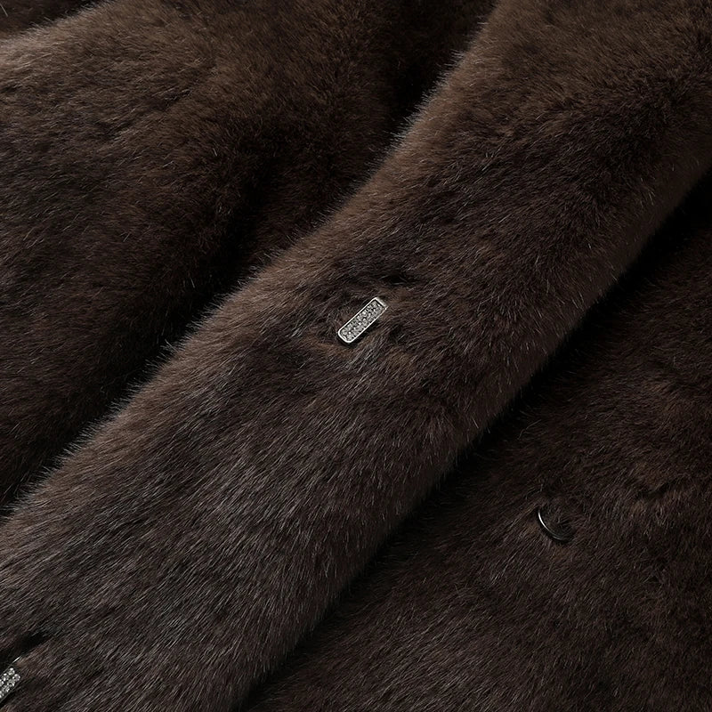 Close-up of dark brown faux fur fabric with a brand label.