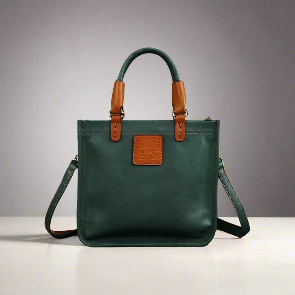 Green handbag with brown accents on a dark surface