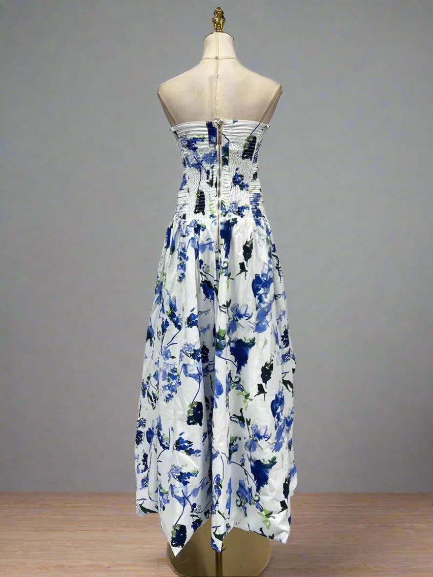Floral strapless dress on a mannequin against a plain background