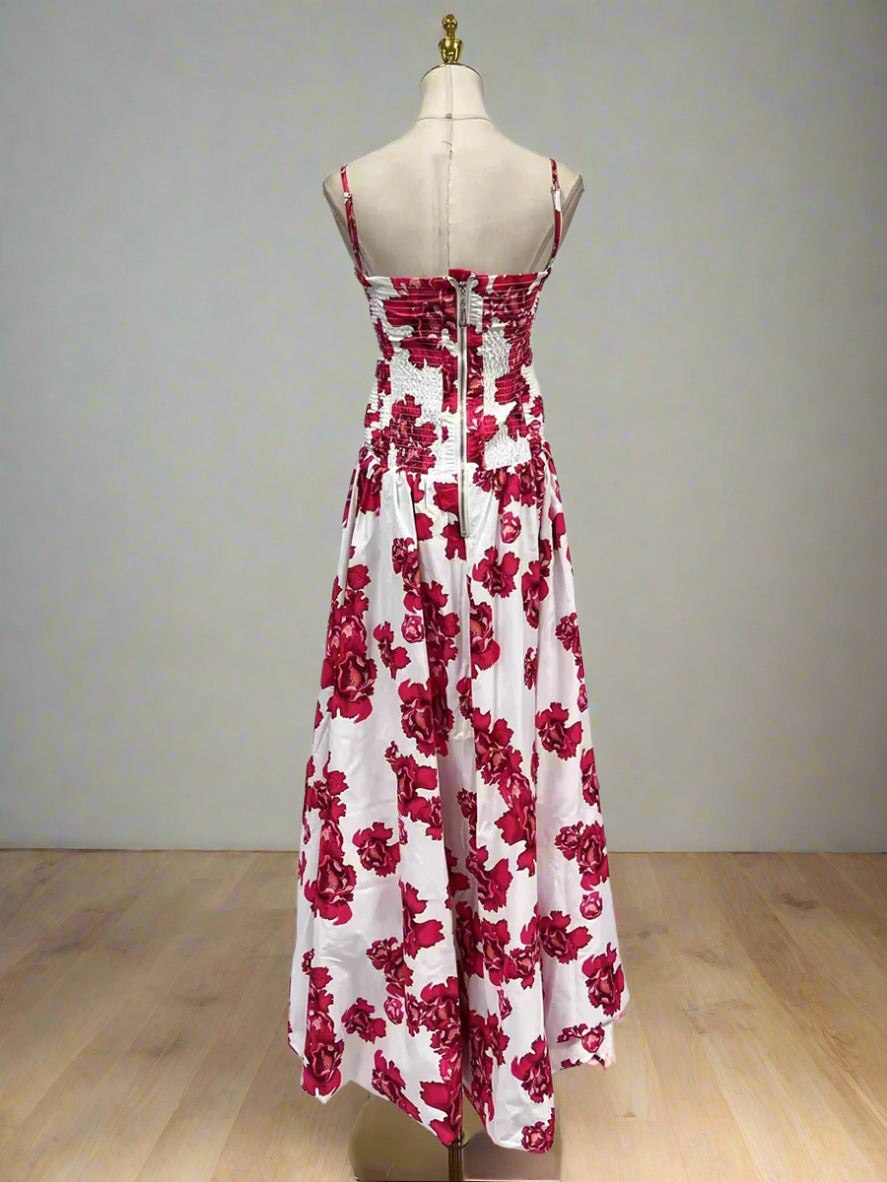 Red floral dress on a mannequin against a white background
