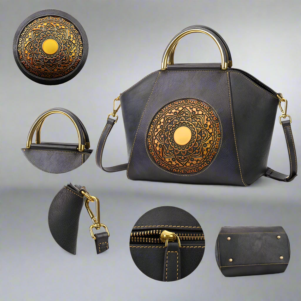 Black handbag with gold embossed design, leather handle, metal hook, zipper, and feet on a white background.