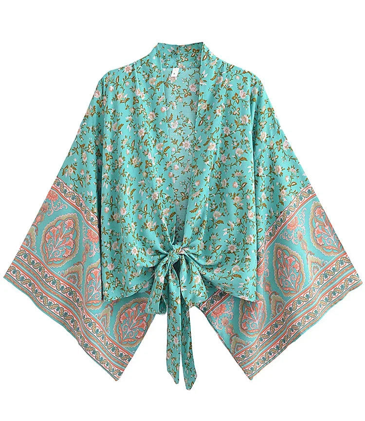 Turquoise floral kimono-style garment on a white background