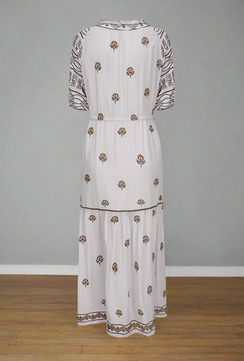 White dress with floral patterns on a white background