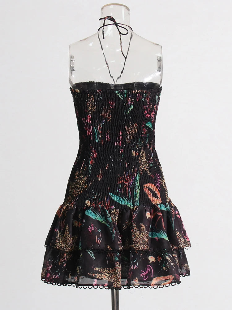 Black strapless dress with colorful floral pattern on a mannequin against a white background