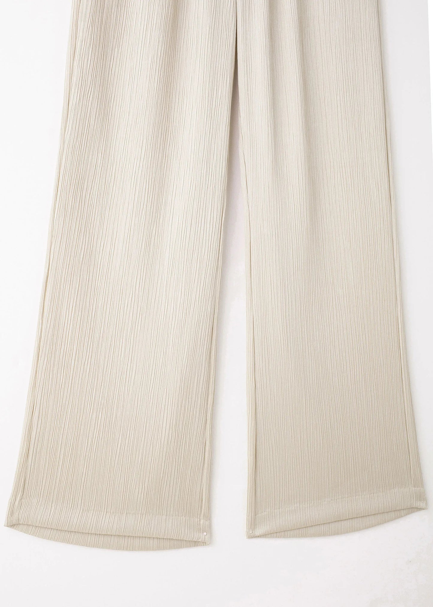 Beige ribbed pants on a white background
