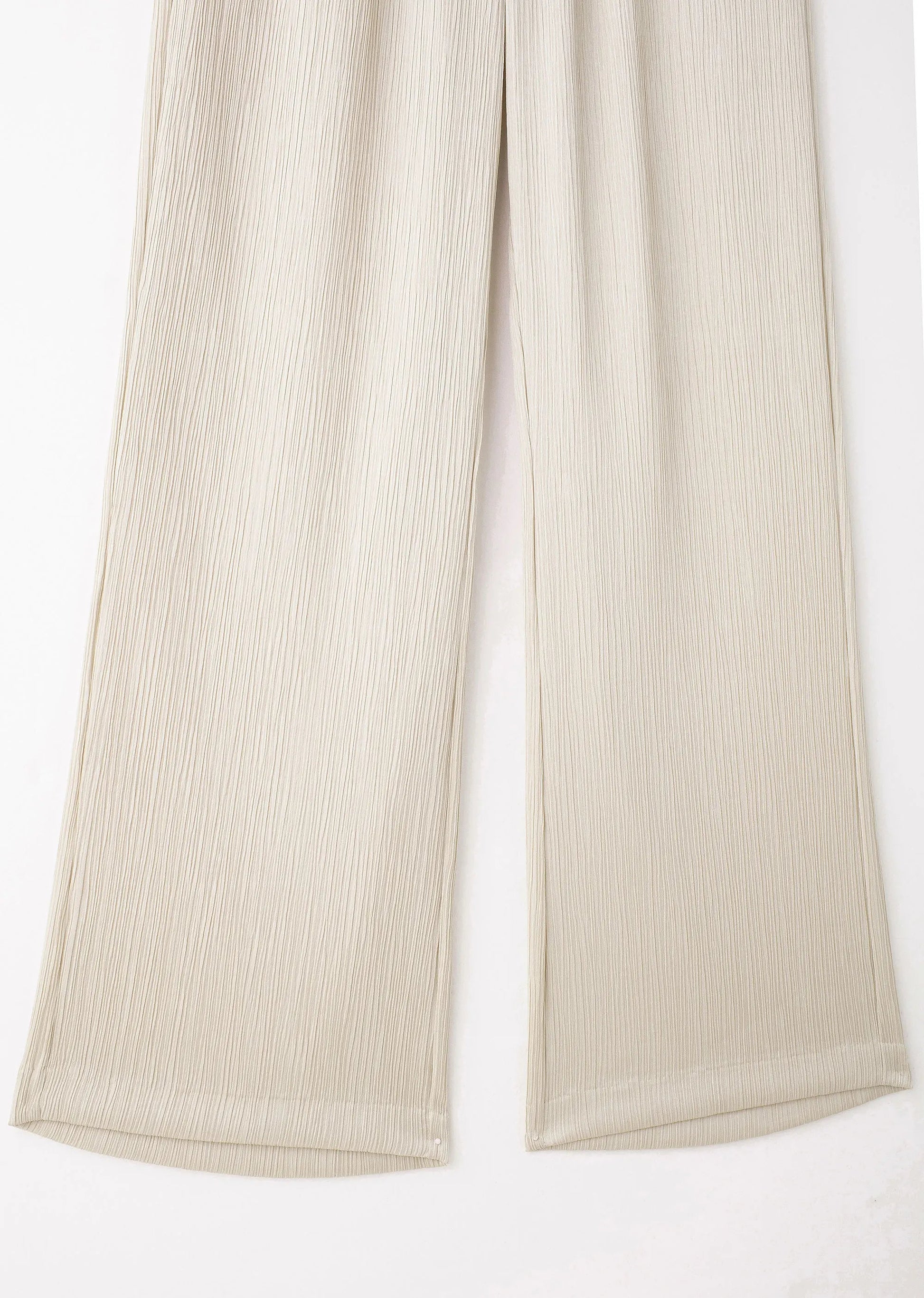 Beige ribbed pants on a white background
