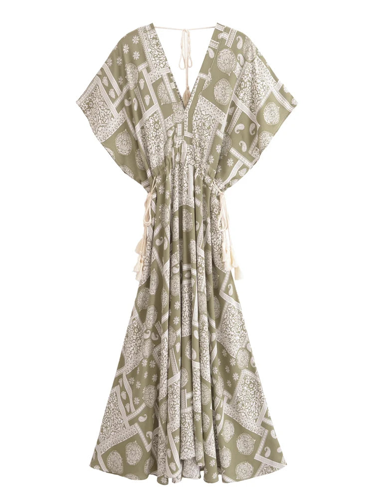 Green and white patterned dress on a white background