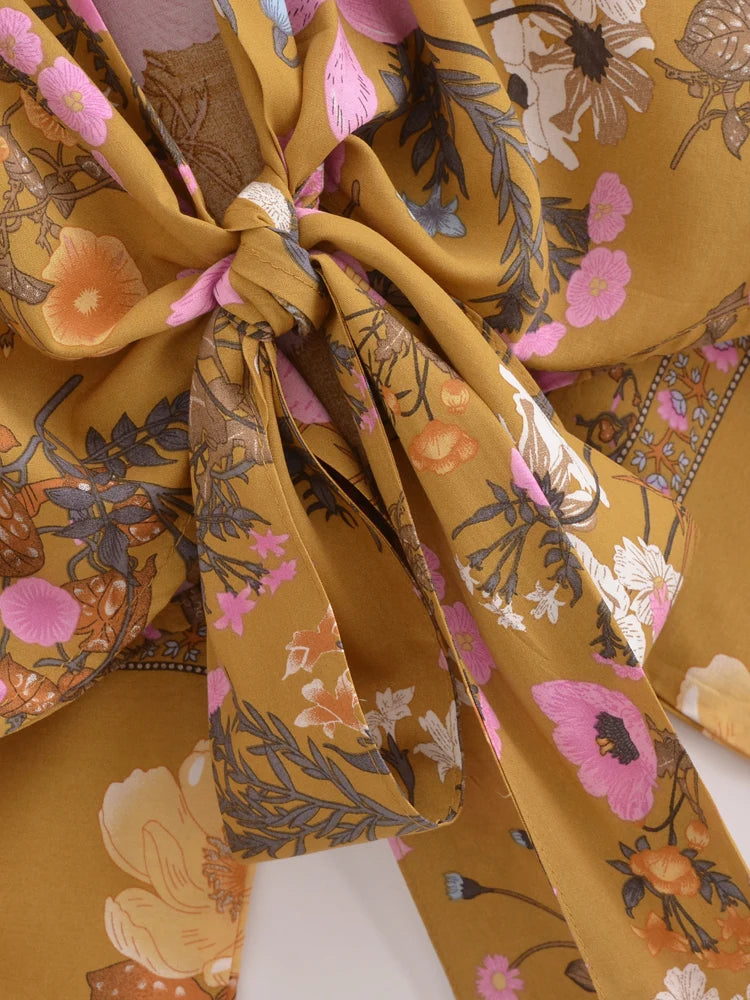 Close-up of a floral-patterned fabric with a prominent bow.
