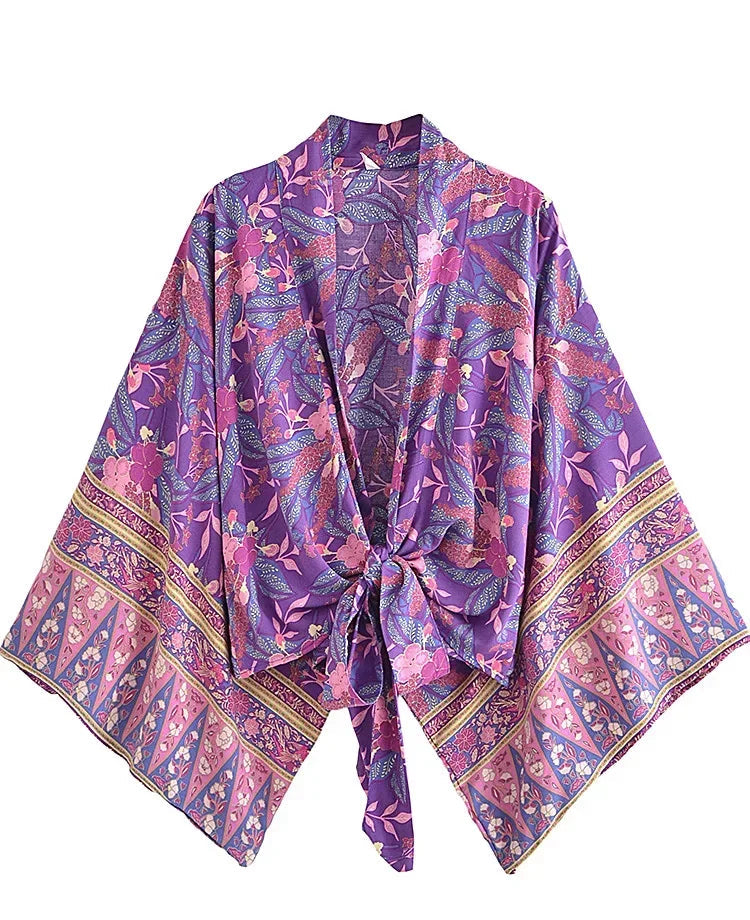 Purple floral patterned kimono on a white background