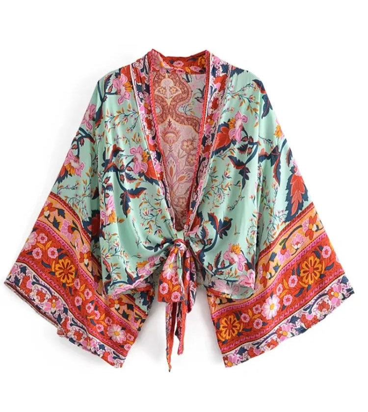 Colorful floral kimono-style robe on a white background