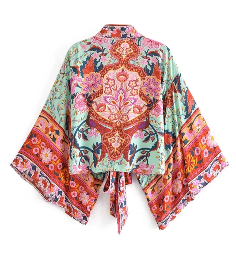 Colorful kimono-style garment with intricate patterns on a white background