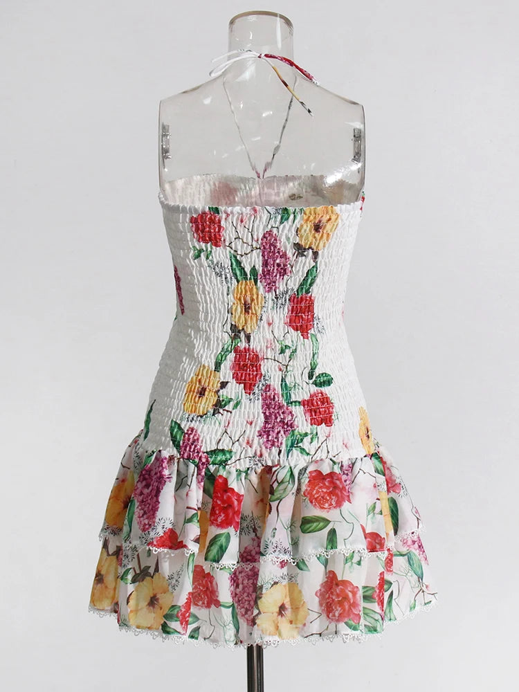 Floral dress on a mannequin against a white background