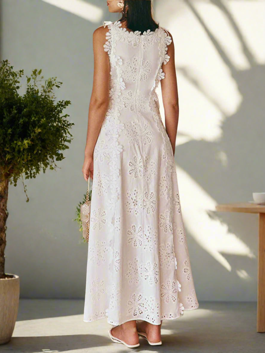 Woman wearing a white lace dress in an outdoor setting