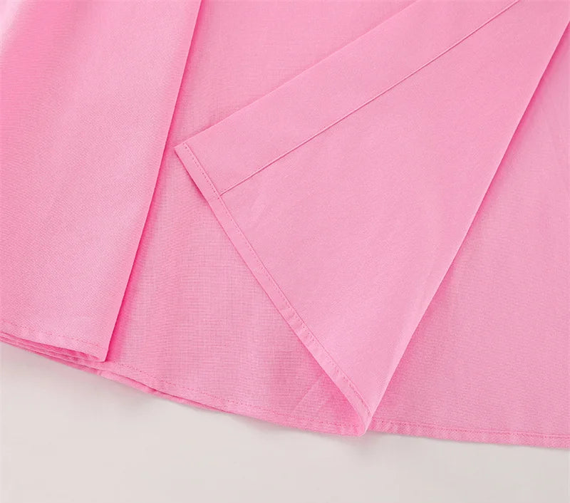 Close-up of pink fabric on a light gray background