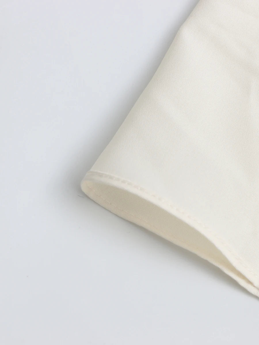 Close-up of a beige fabric on a light gray background