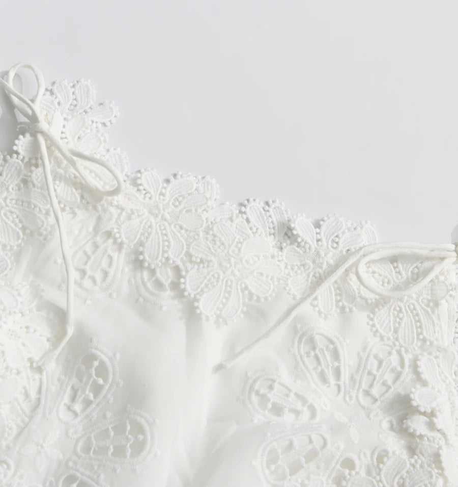 White lace garment on a light gray background